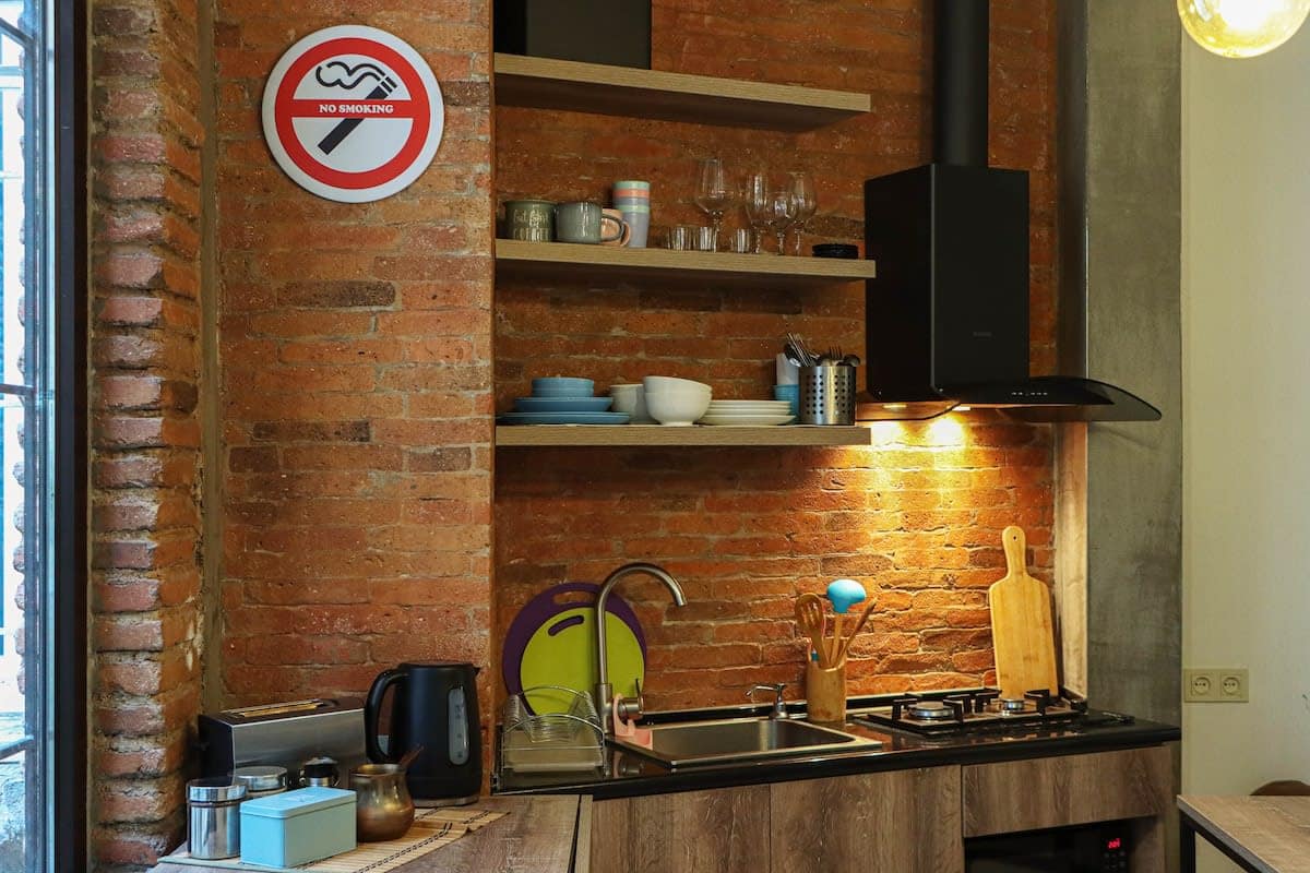 Fully equipped with all the essentials, it allows you to prepare meals while staying connected with the rest of the room