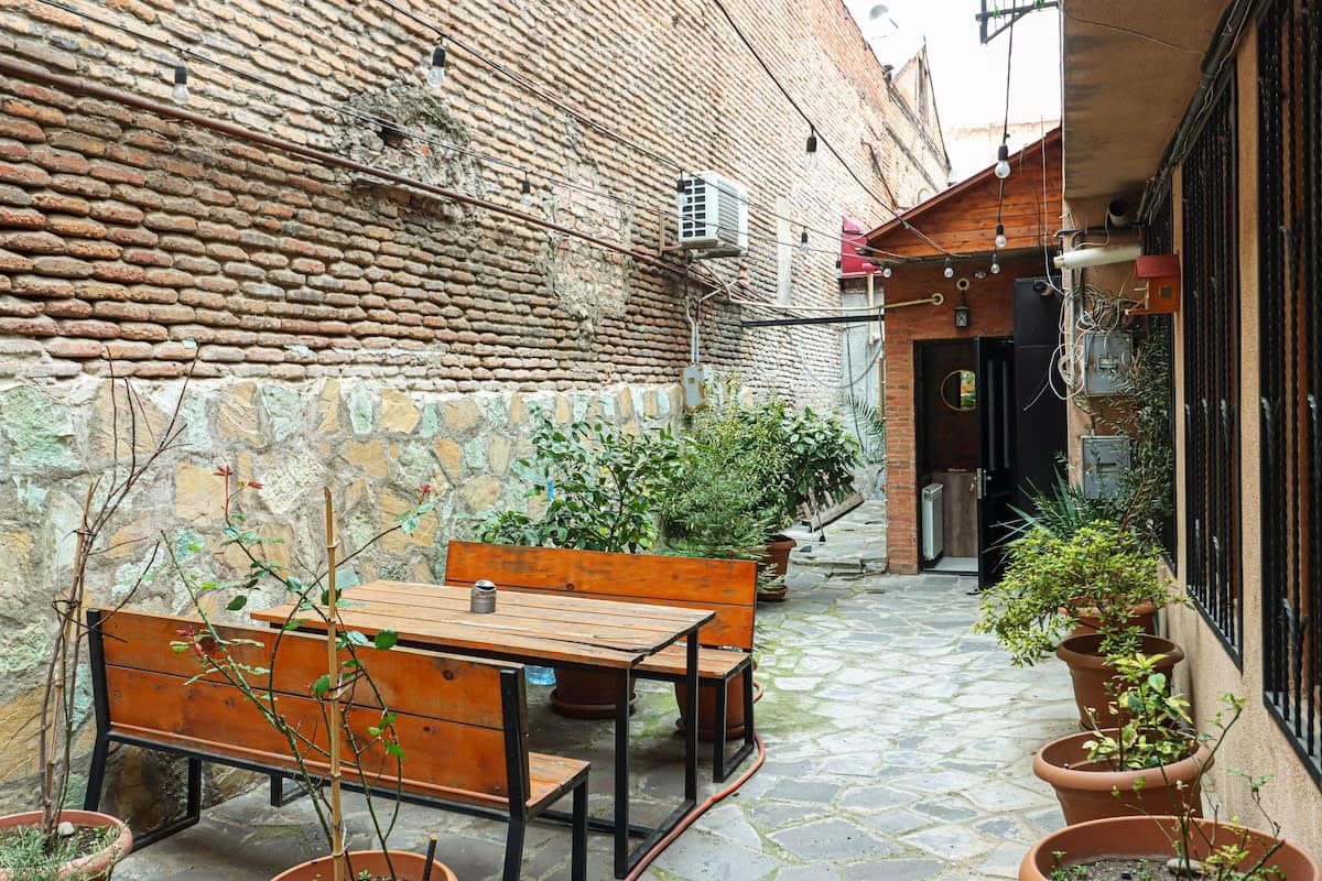 Private place is a peaceful retreat, complete with a comfortable chair and table, perfect for enjoying the outdoors