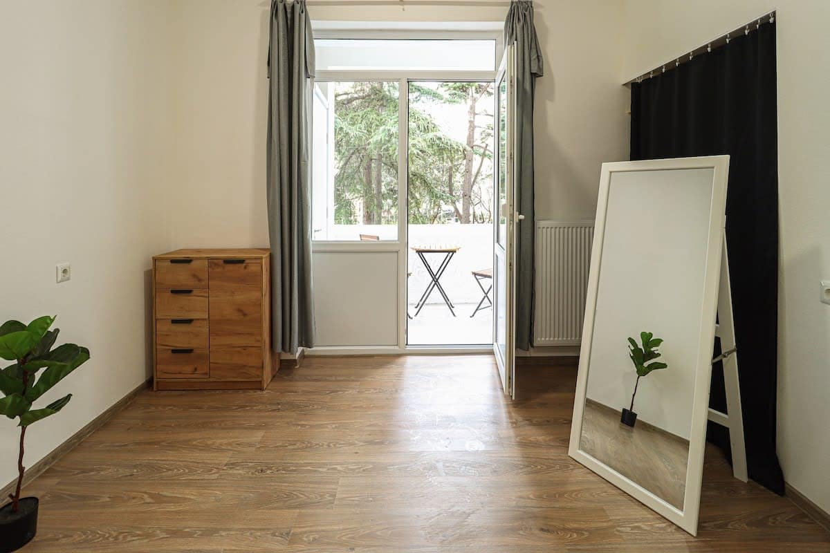 Large windows fill the space with natural light, creating a bright and airy atmosphere throughout the day
