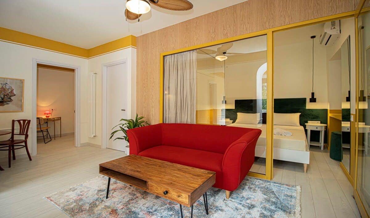 Bold and stylish red sofa adds warmth and character to the living room