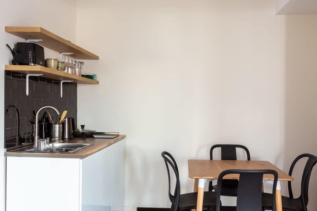 The dining table for four is perfect for shared meals or board games.