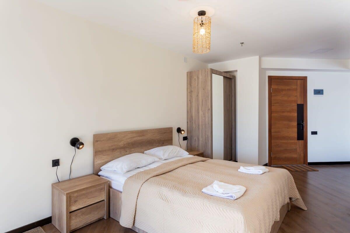 The bed is centered for easy movement around the room.
