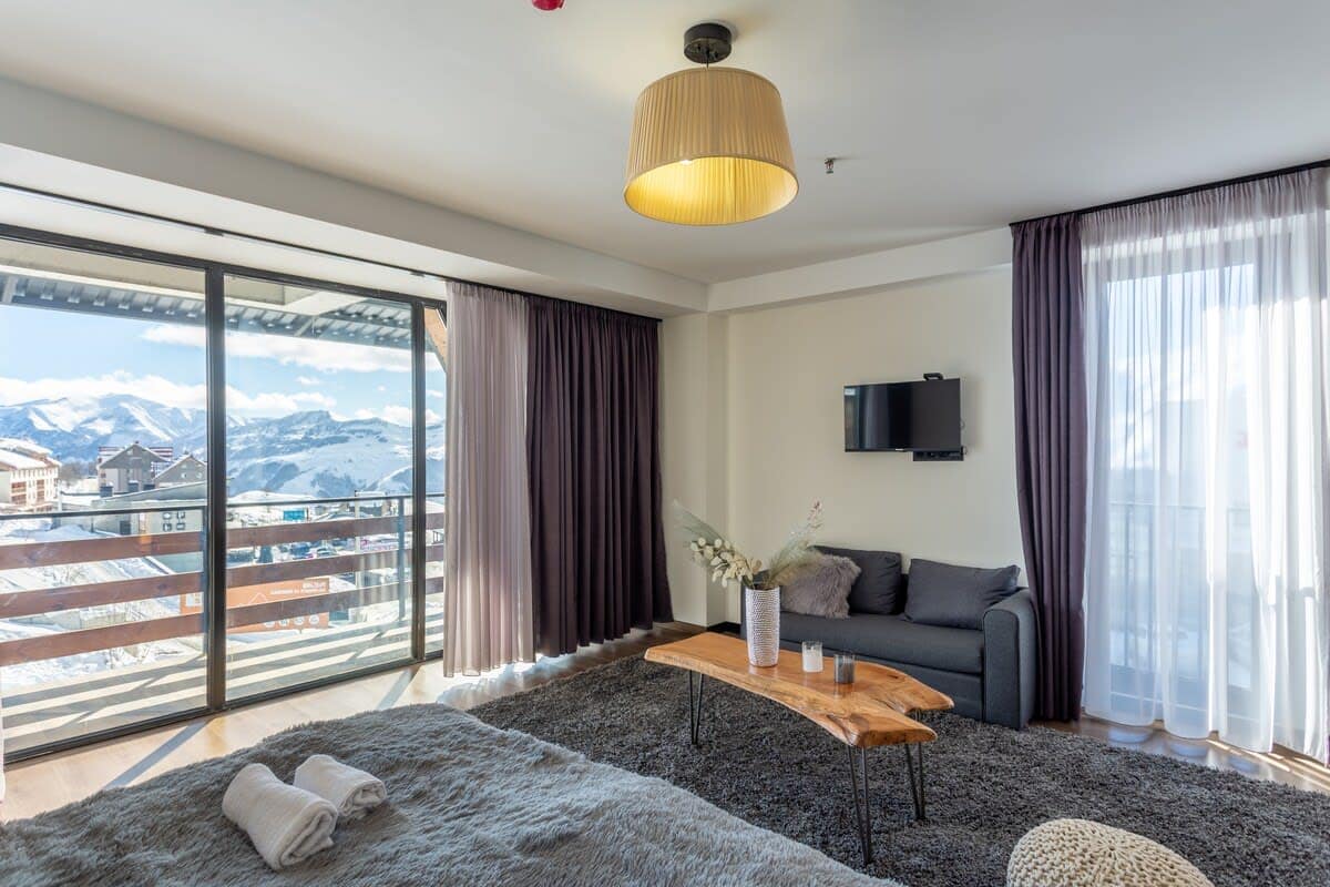 A comfy rug by the bed adds warmth underfoot.