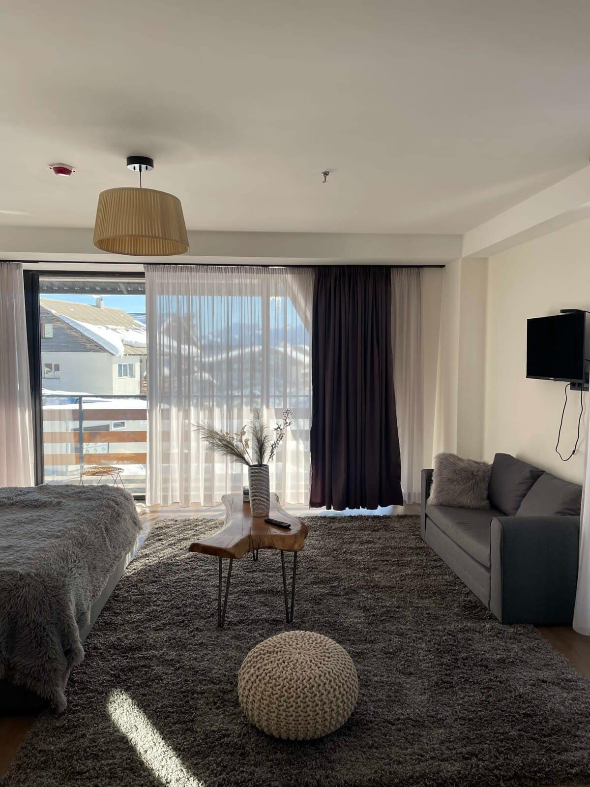 Modern curtains can be drawn for a cozy, private atmosphere.