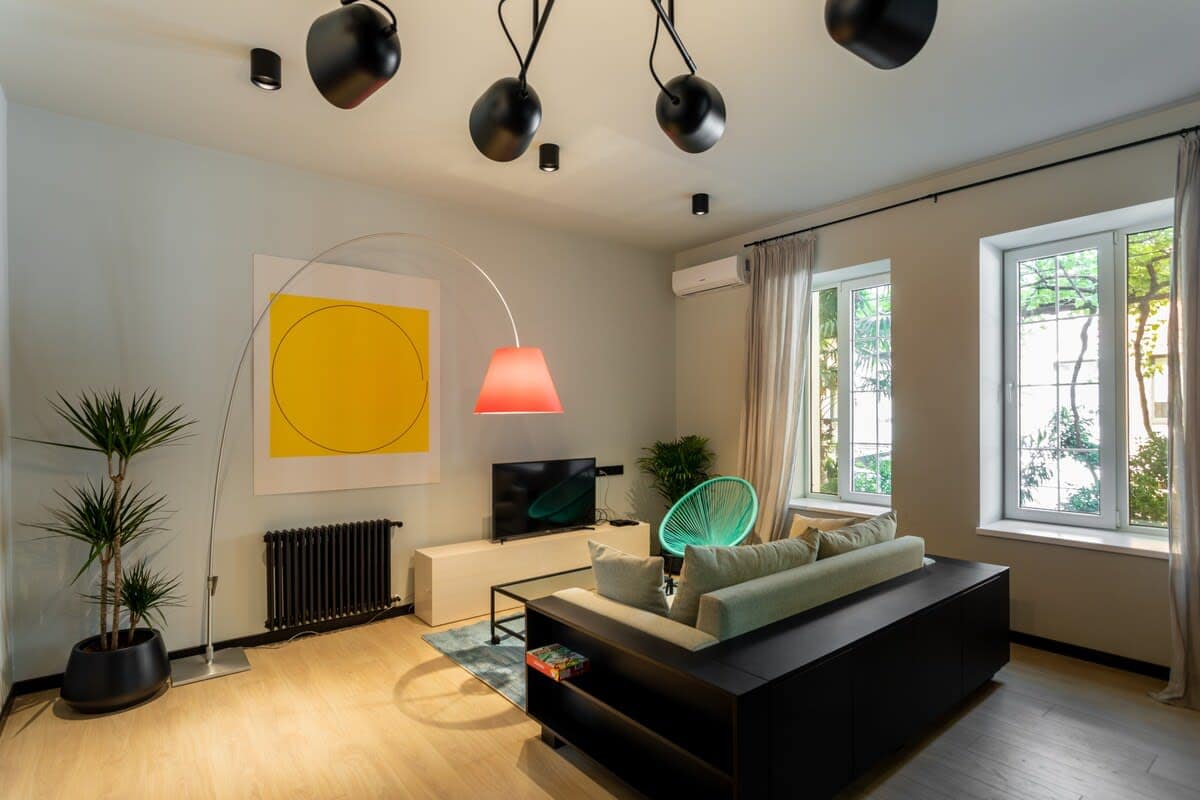 Living room features comfortable sofas, perfect for lounging, reading, or enjoying a conversation.