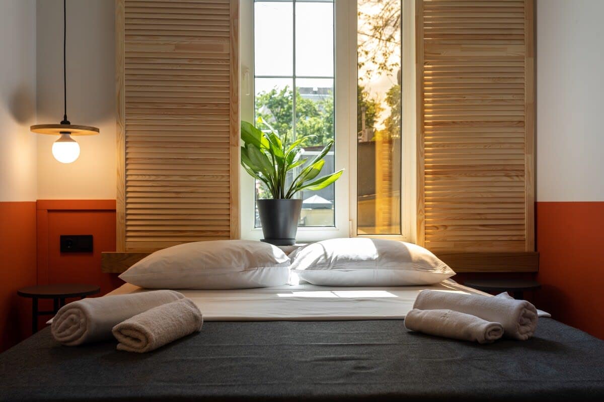 Comfortable double bed is dressed in crisp, fresh linens, ensuring a restful and relaxing sleep
