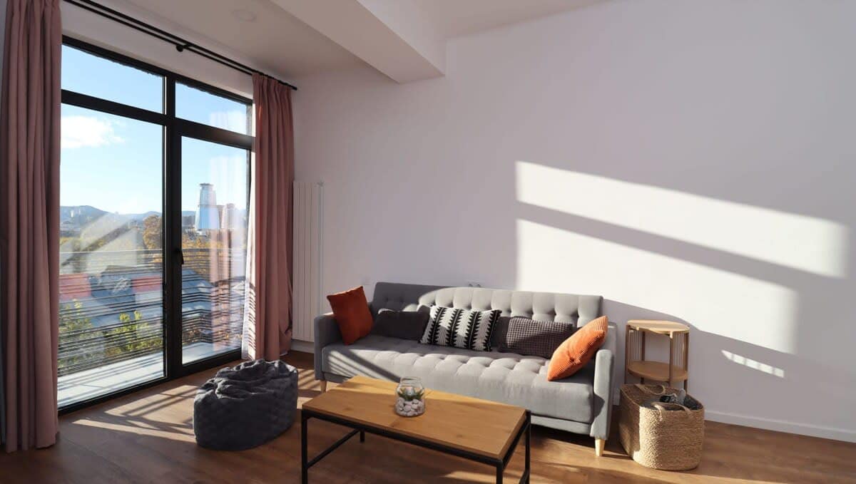 Comfortable sofa bed provides both a cozy seating area and an extra sleeping option, making the space versatile and functional