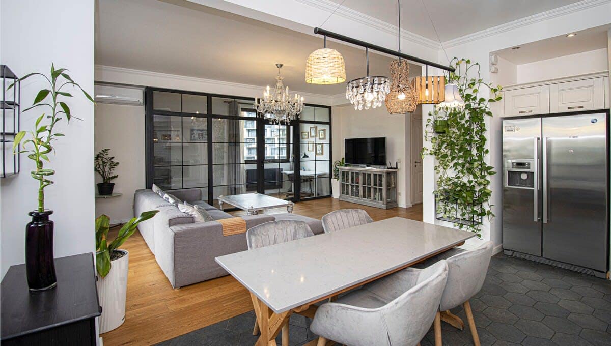 The greenery enhances the overall style of the apartment.