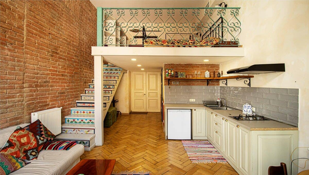 Spacious living room seamlessly blends with an open kitchen