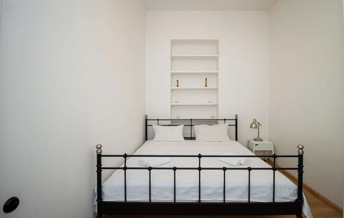 Rest easy in the comfortable double bed, complete with fresh linens for a cozy night’s sleep