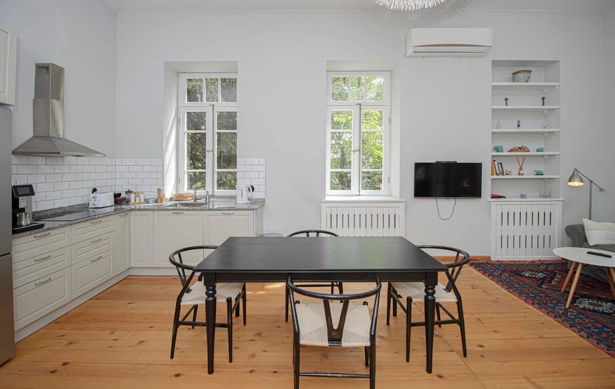 Table and chairs offer a comfortable place to sit and dine, making it a great spot to share a meal or even get some work done