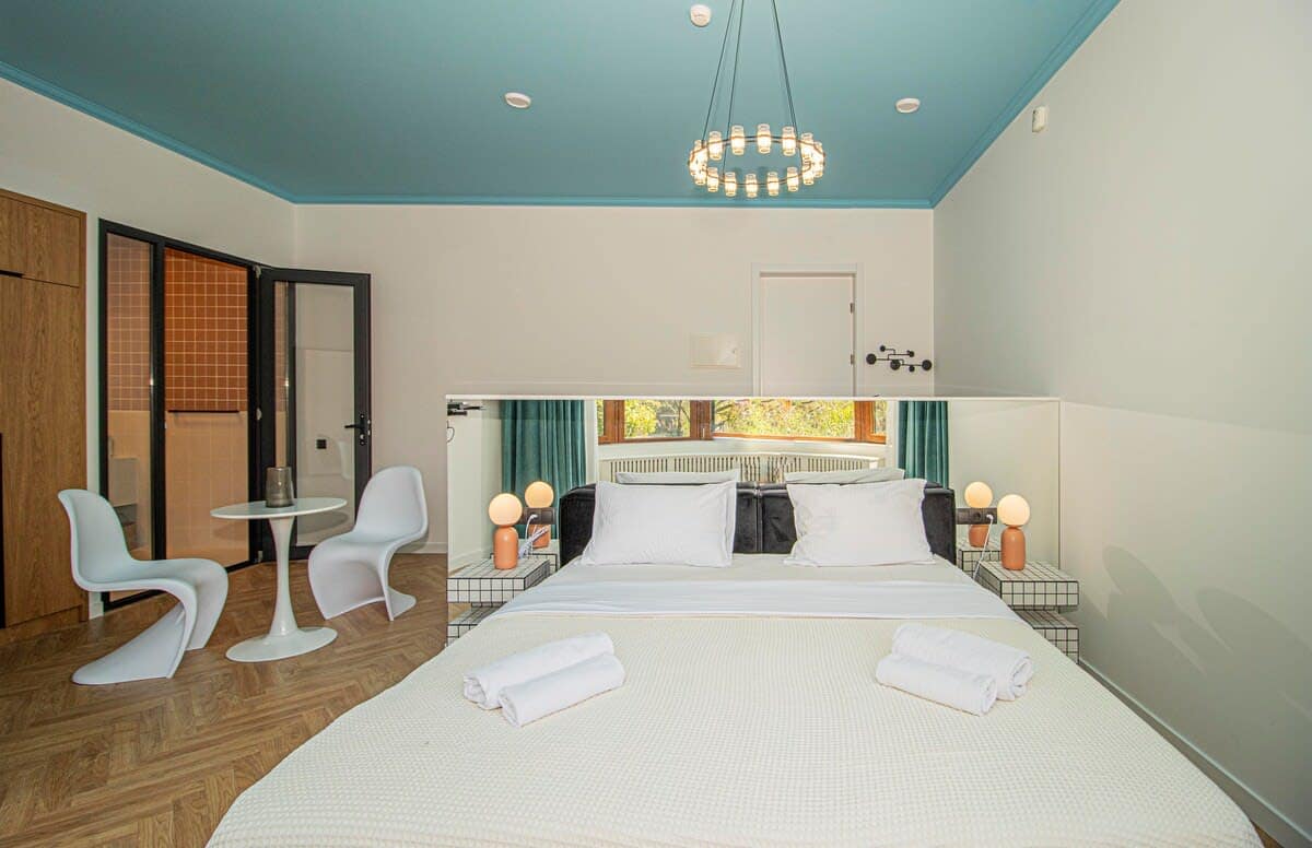 Comfortable double bed with soft, fresh linens ensures a restful sleep