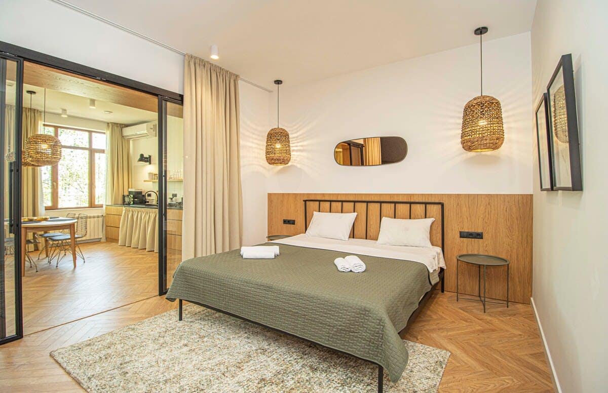 Comfortable double bed with soft, fresh linens ensures a restful sleep
