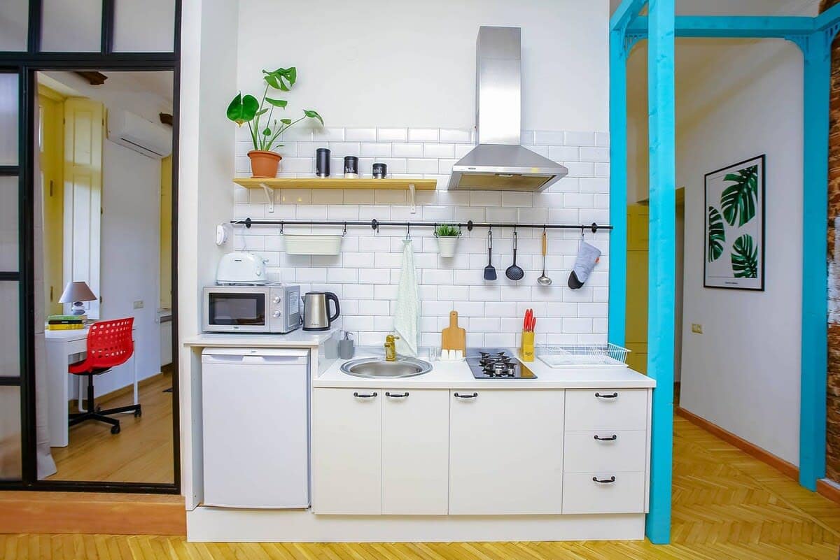 Open kitchen is fully stocked with all the essentials.
