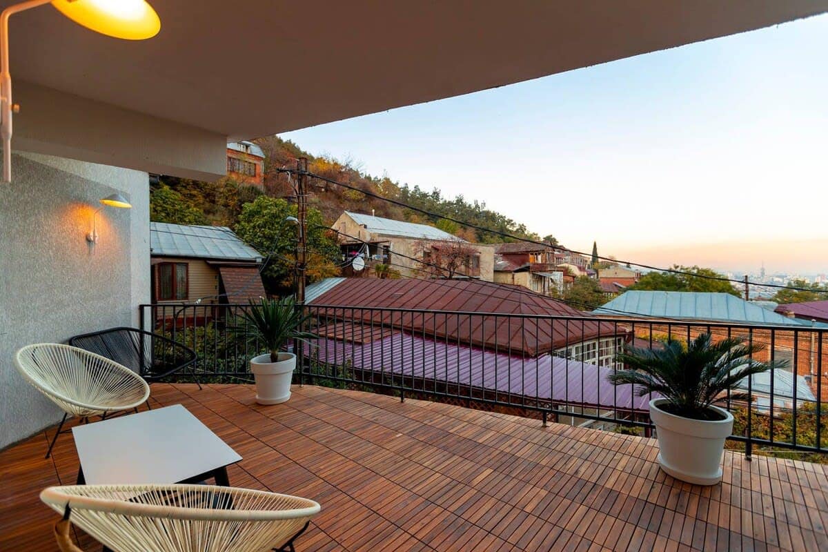 Terrace with comfortable furniture, offering a breathtaking panoramic view for ultimate relaxation