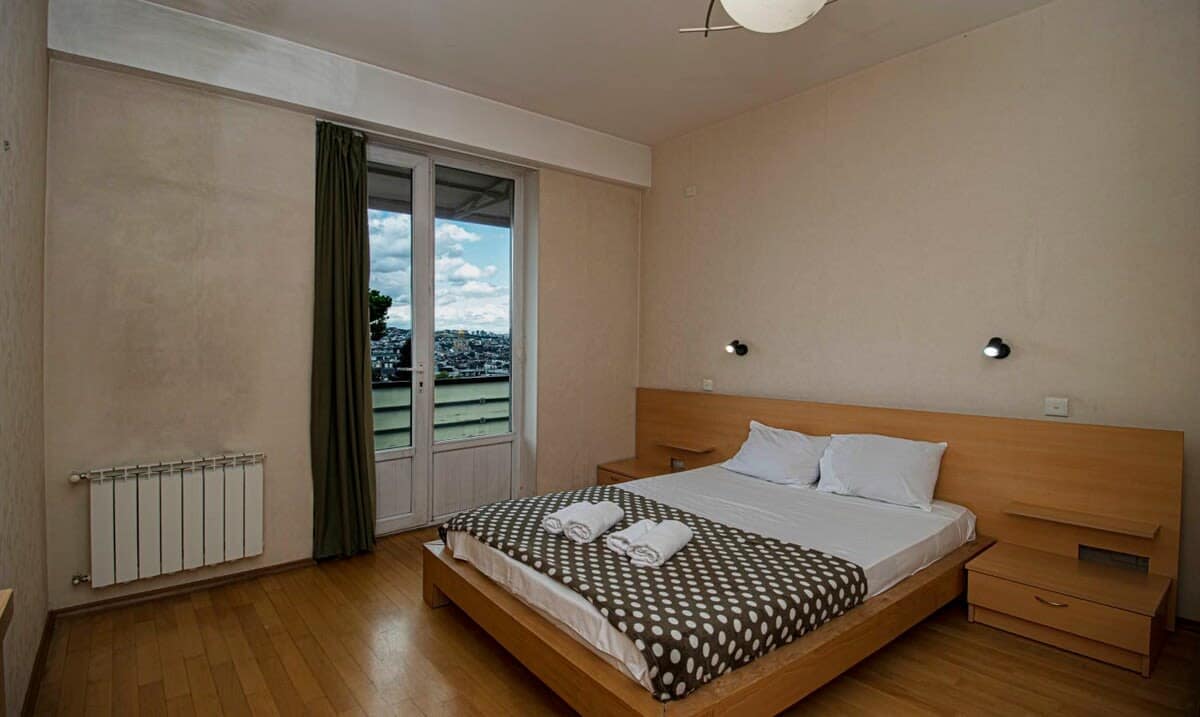Spacious and inviting double bed takes center stage