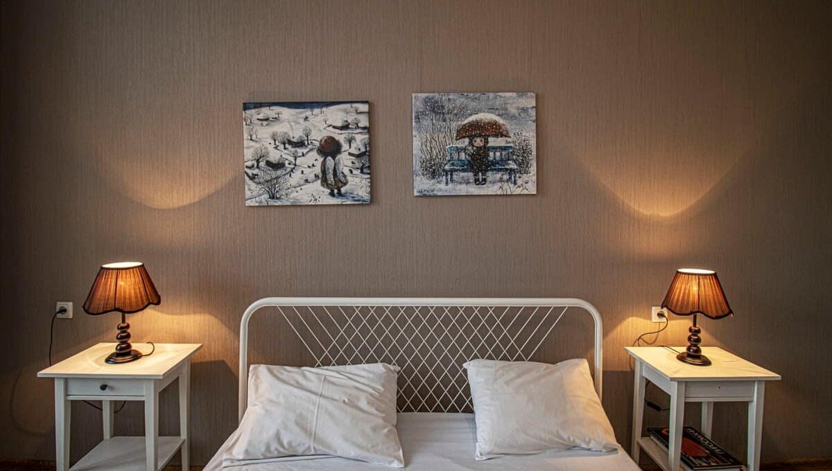 Stylish bedding complements the room’s aesthetic, creating a cozy and inviting atmosphere
