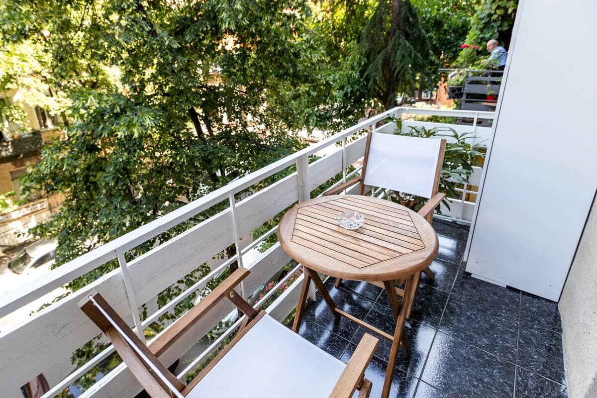 Step out onto your private balcony and take in the stunning views of the city's historic architecture