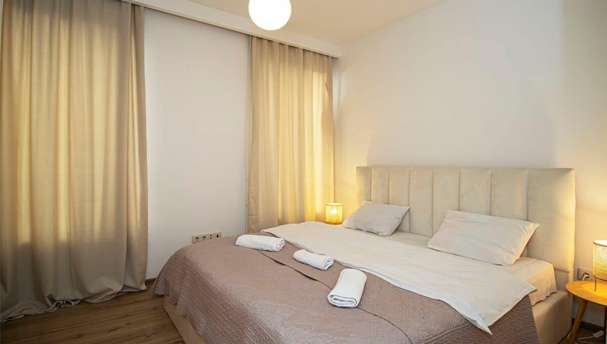 Comfortable double bed with soft, fresh linens ensures a restful night's sleep