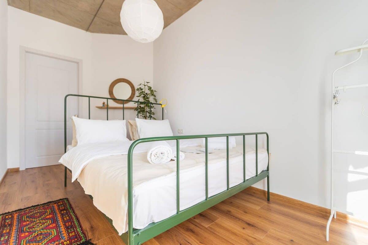 Sink into the cozy double bed, dressed in fresh linens for a restful sleep