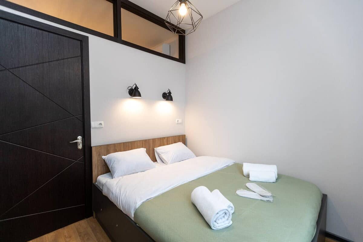 Comfortable double bed, dressed in crisp, fresh linens, promises a great night’s sleep