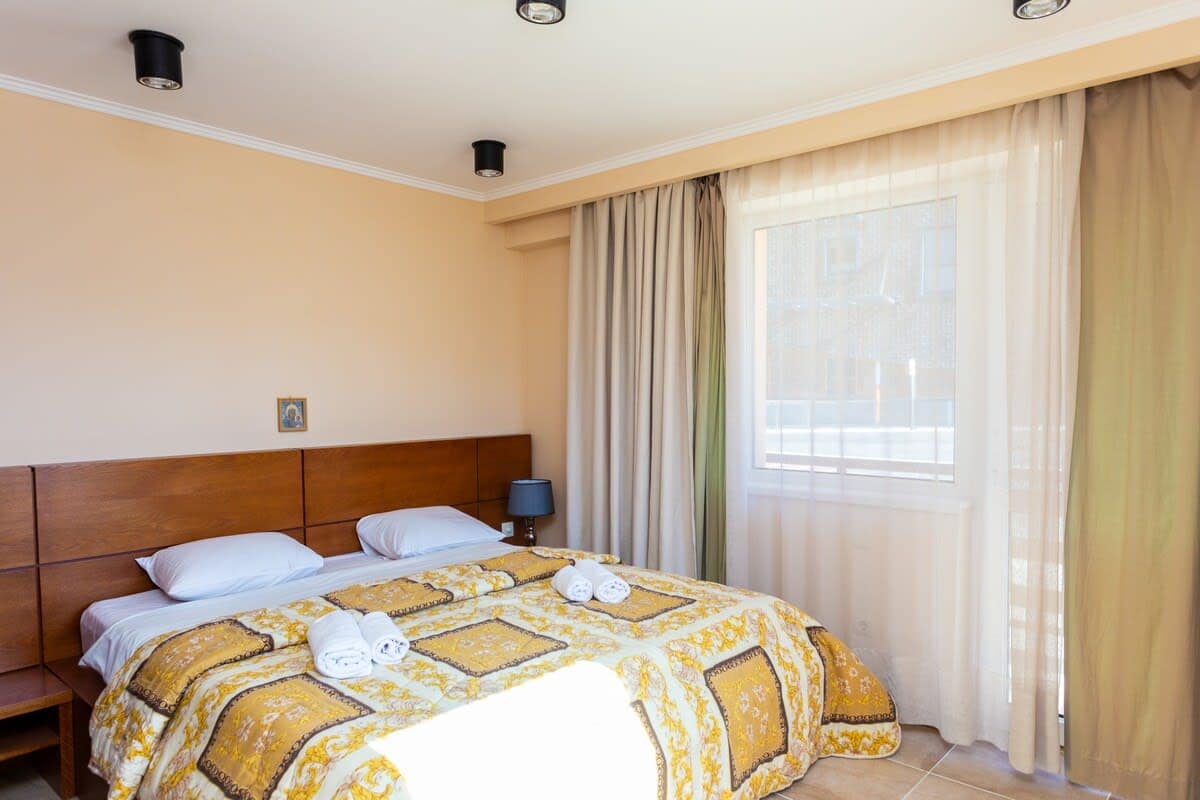 This bedroom is simple yet colorful, with comfy bedding for a good night's sleep.