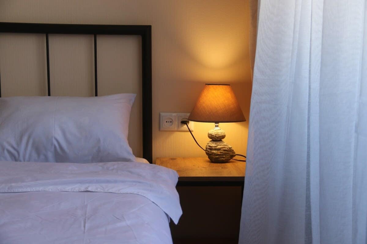 Enjoy the convenience of bedside lamps in the bedroom, offering soft illumination and enhancing the warm, inviting atmosphere of your private space.