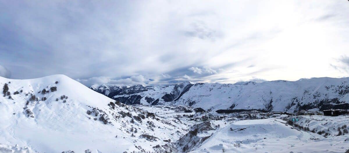 Enjoy the breathtaking views of the snowy mountains of Gudauri.