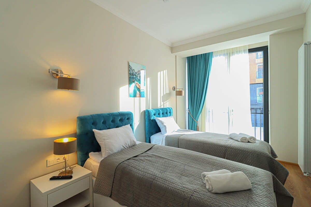 There are two single beds in the other bedroom.