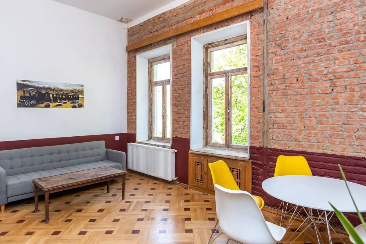 The living room features vintage decor and has an old Tbilisian vibe.