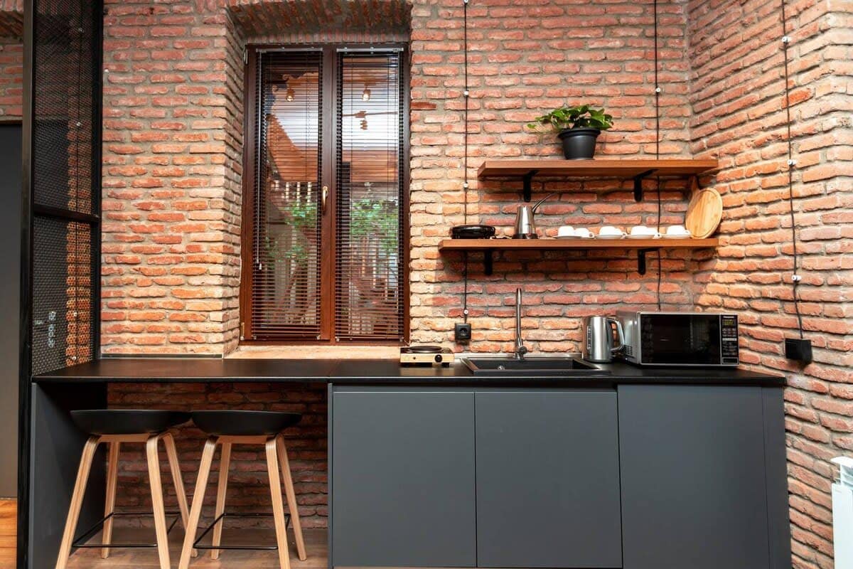 Dining space and modern, fully-equipped kitchen is ideal for enjoying meals, whether it's a quick breakfast or a cozy dinner