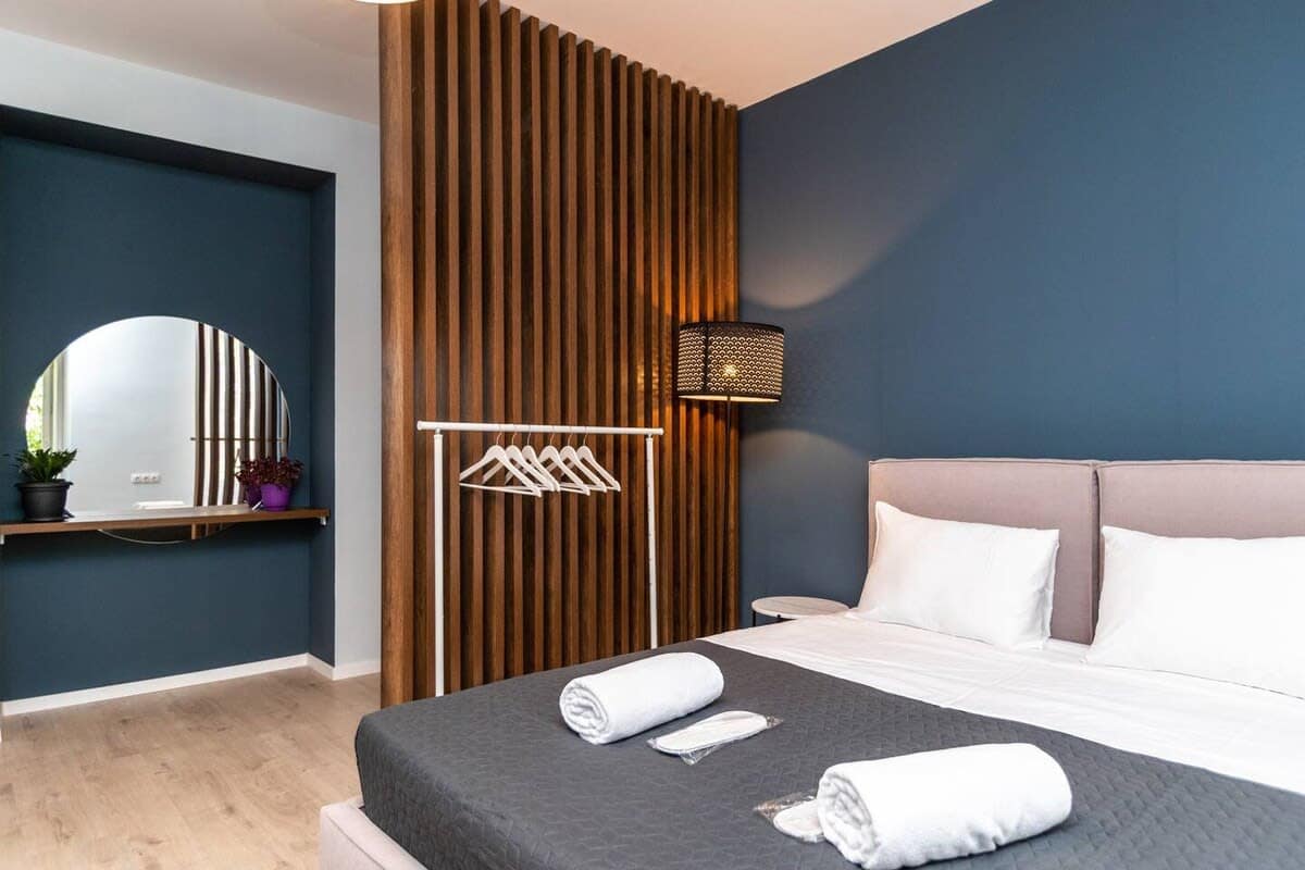 Double bed is dressed in fresh linens, offering a clean and inviting space for a good night’s sleep