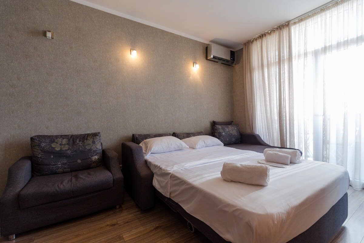 Inviting double bed ensures a restful night’s sleep. Stay cool and comfortable in any season with an air conditioning unit that keeps the room at the perfect temperature