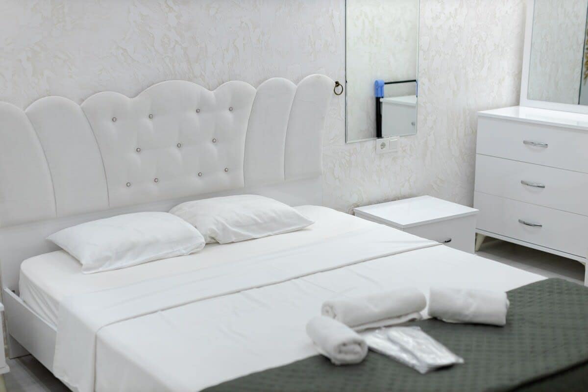 Soft bedside lamps create a warm and soothing atmosphere, perfect for winding down in the evening