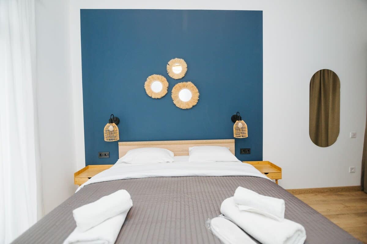 Thoughtfully placed bedside lamps provide warm lighting