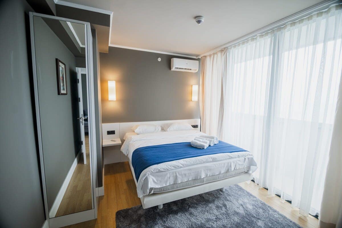 Double bed is dressed in fresh, high-quality linens, guaranteeing a restful sleep
