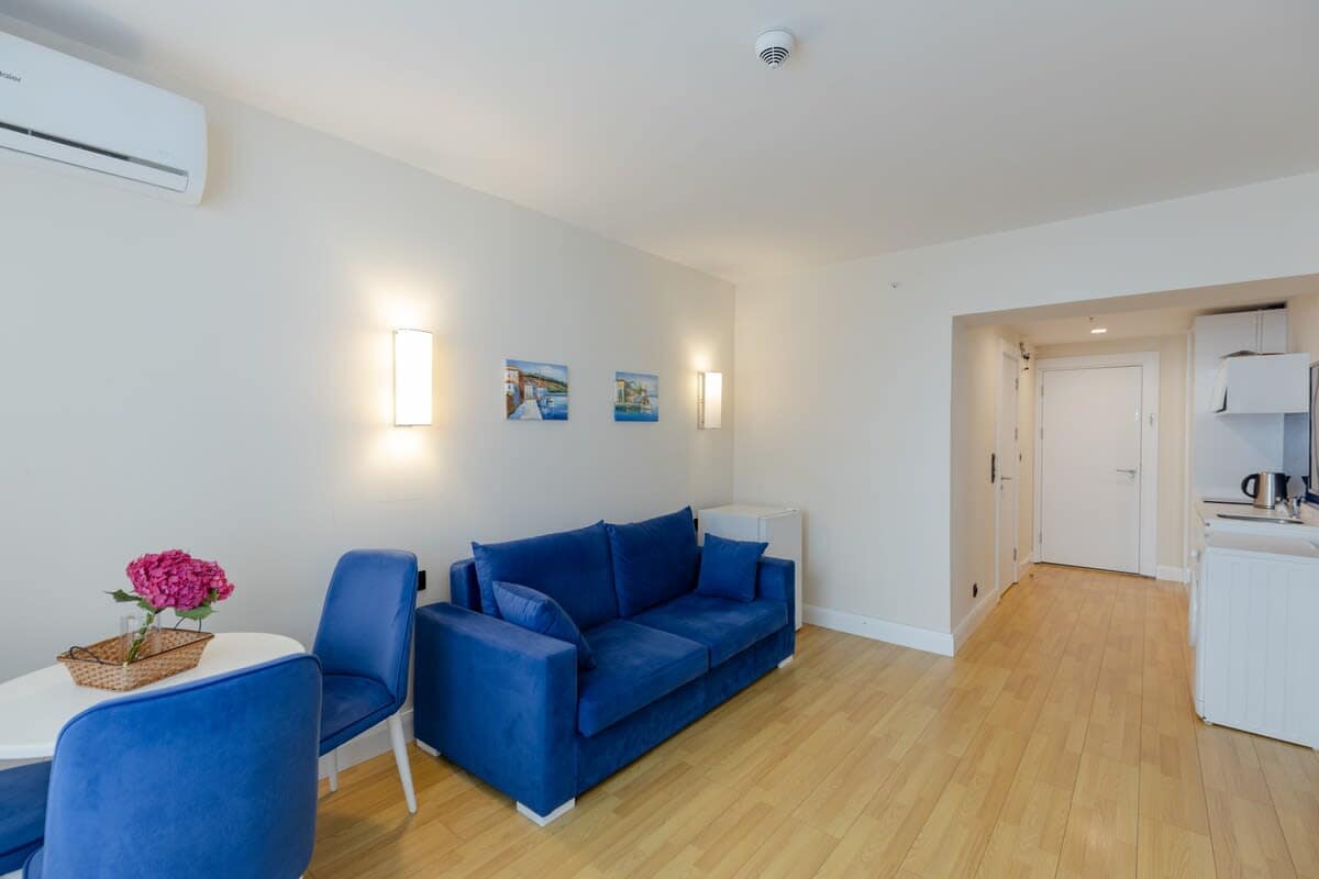 Cozy seating and elegant design complement the room’s inviting atmosphere