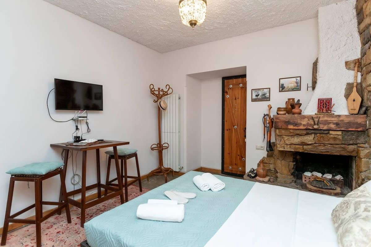 TV in front of a bed for entertainment