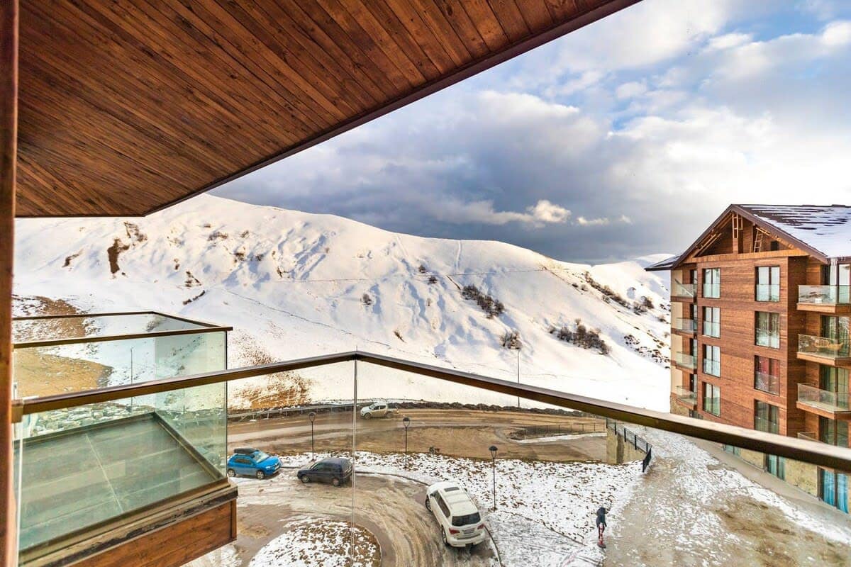 Take in the serene beauty of the snowy peaks, a stunning sight visible from the balcony.