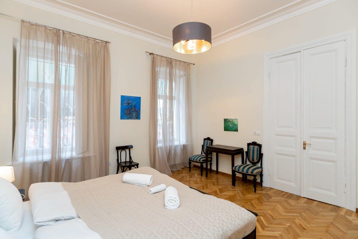 Large windows flood the room with natural light, creating a bright and airy ambiance