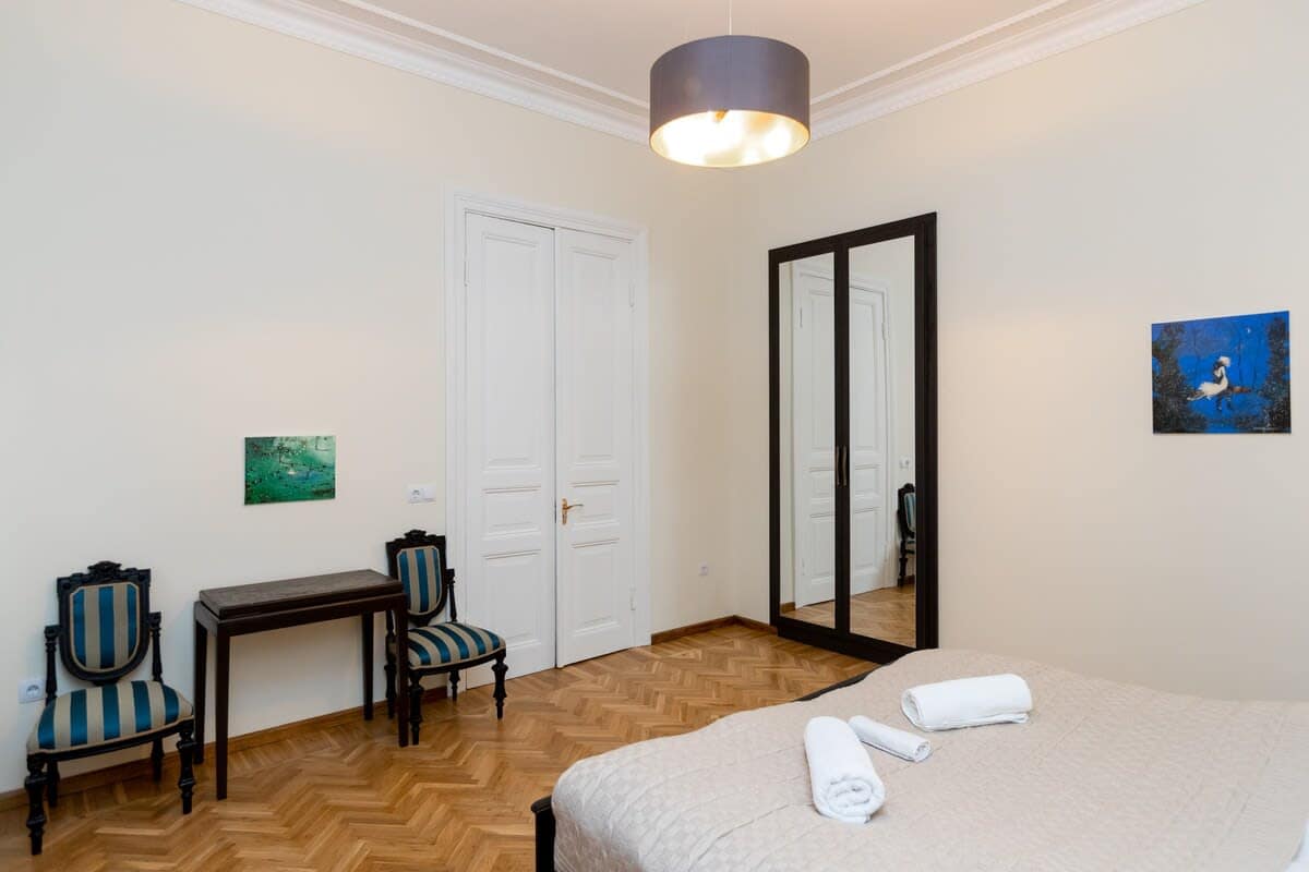 Room includes a spacious wardrobe, providing ample storage for your belongings