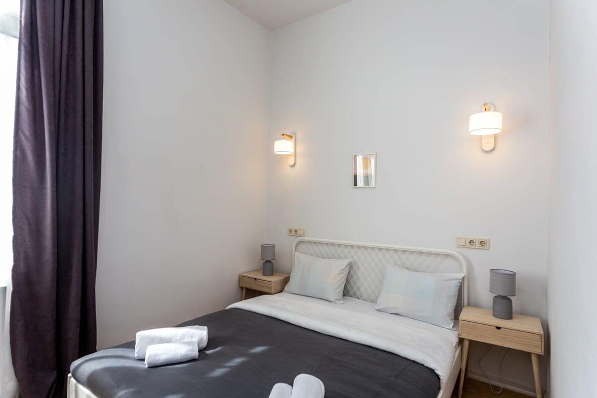 Cozy double bed is the perfect place to unwind, offering both comfort and support for a restful sleep.