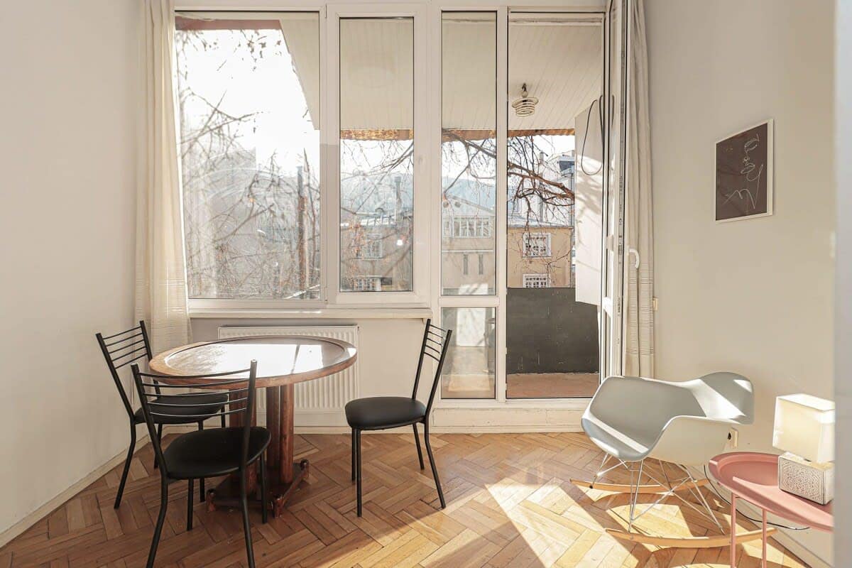 Well-arranged table and chairs provide a comfortable setting for enjoying breakfast, lunch, or dinner