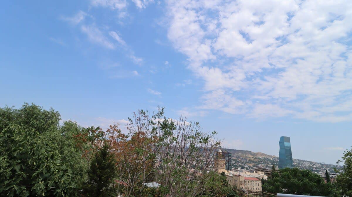 Step onto the charming balcony and take in the breathtaking view of the surrounding area