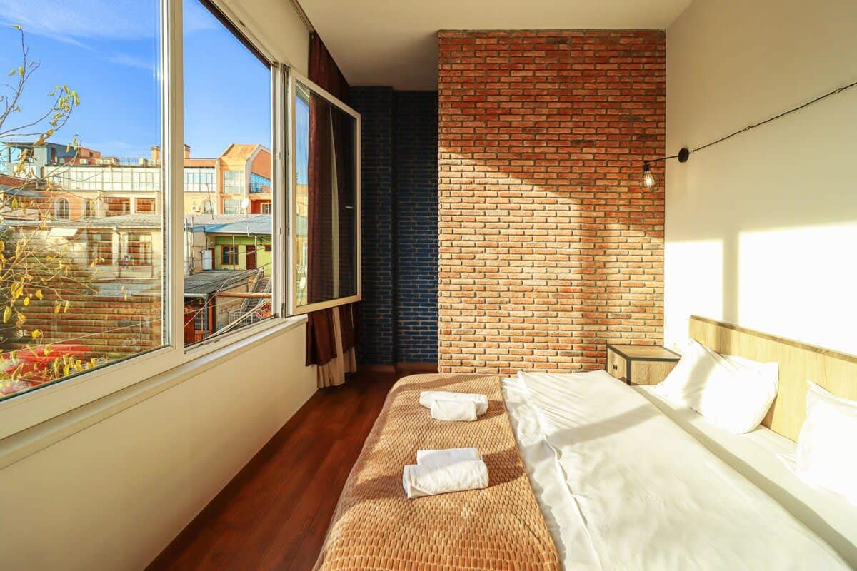 Dressed in fresh, high-quality linens, ensuring a restful night's sleep