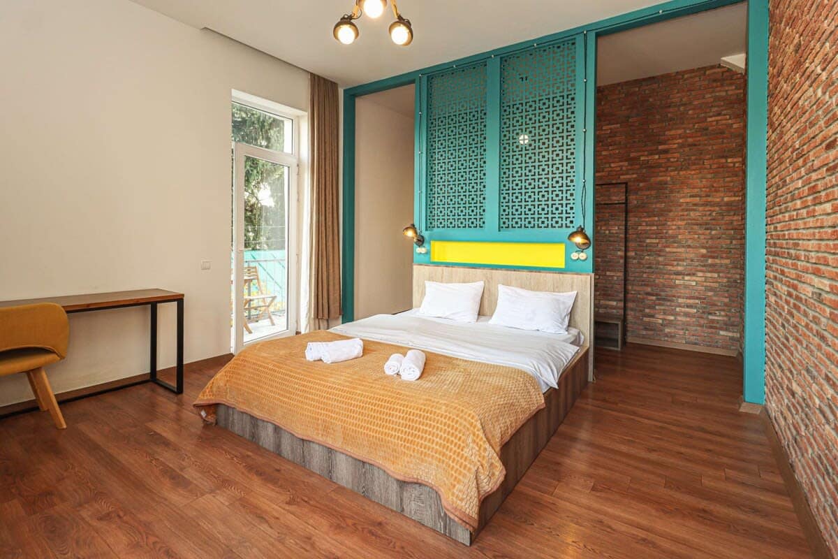 Bright and stylish bedroom combines comfort, practicality, and charm, ensuring a delightful and restful stay