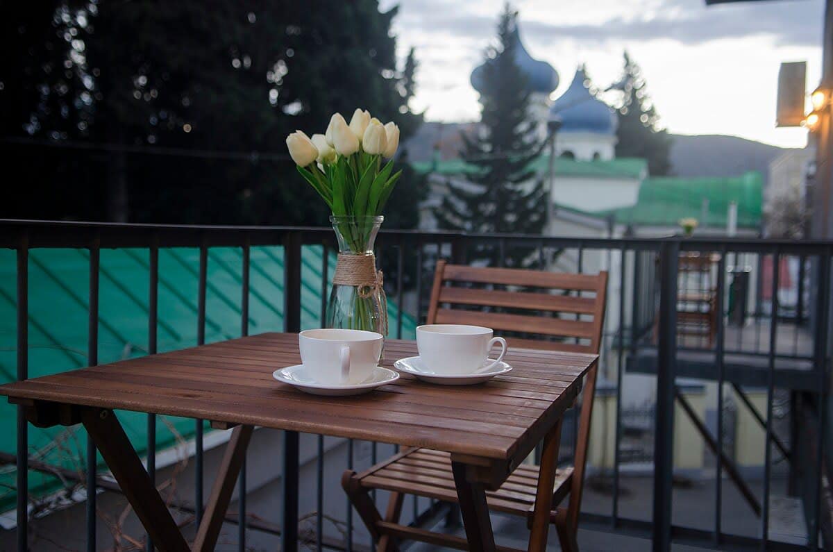 Enjoy the fresh air and scenic views from the private balcony