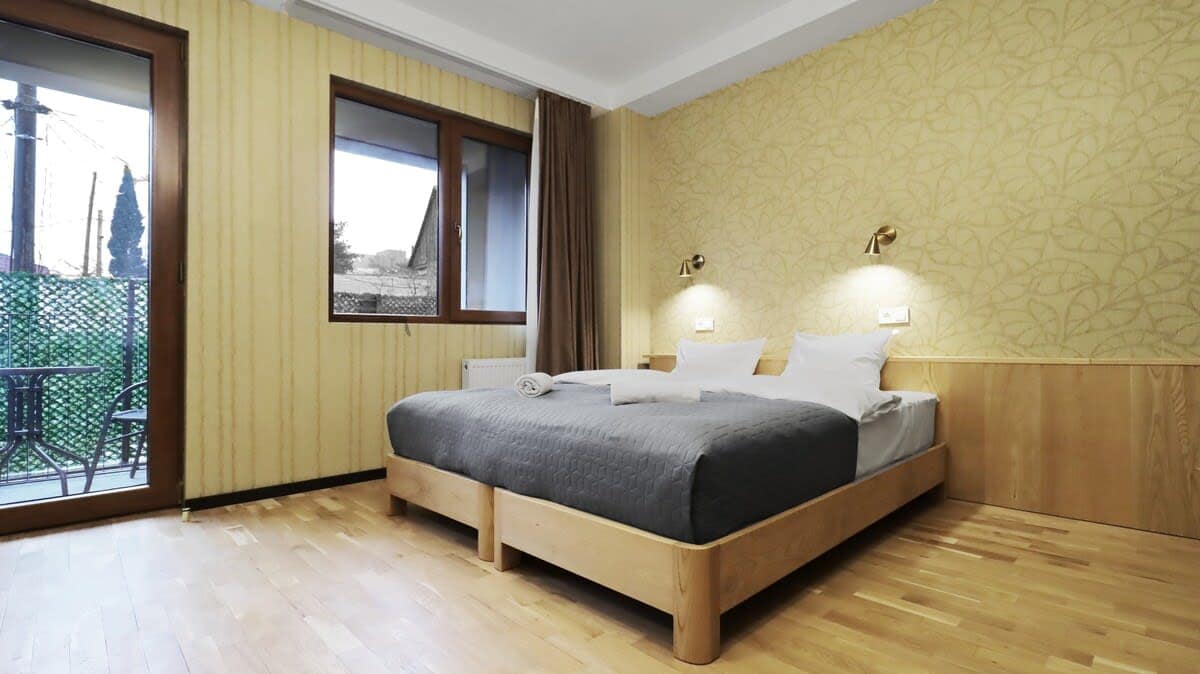 Sink into the plush double bed, designed for maximum comfort with high-quality linens and a cozy atmosphere.