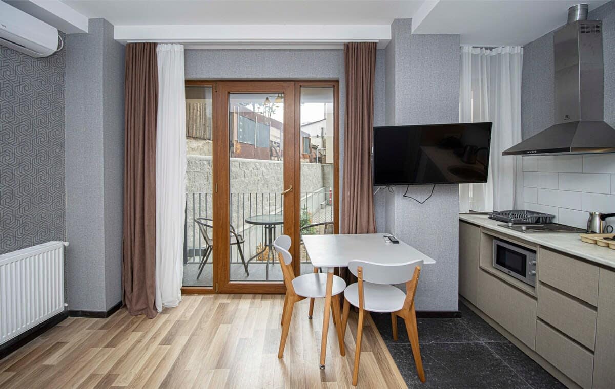 Inviting dining area features a well-sized table with comfortable seating