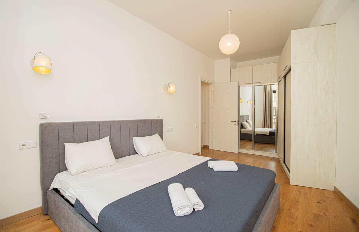 Well-placed mirror enhances the brightness of the room, reflecting natural light and adding a sense of openness